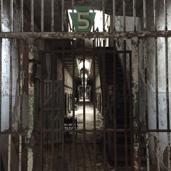 A view down a closed corridor at Eastern State Penitentiary.